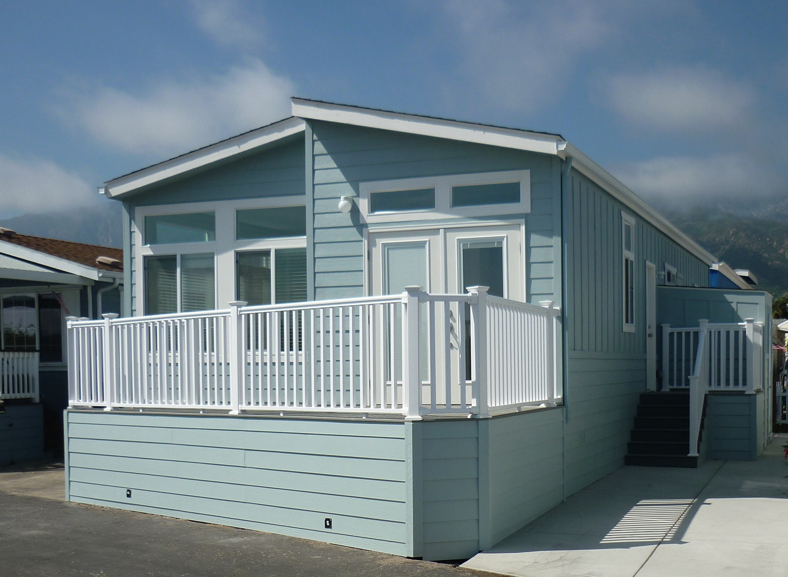 new manufactured home in mobile home park blue exterior